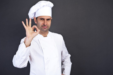 portriat of the cook over dark background