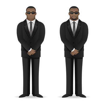 Black man bodyguard stands in closed pose