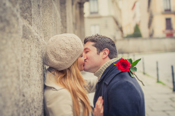 couple with a rose kissing on valentines day