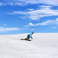 Snowboarder in winter mountains
