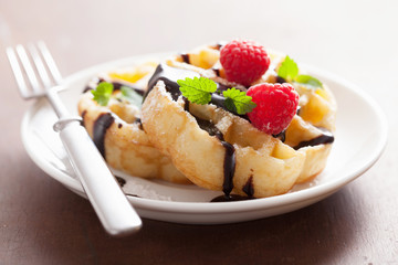 Belgian waffles with chocolate and raspberry for breakfast