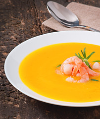 Pumpkin soup with shrimp and rosemary