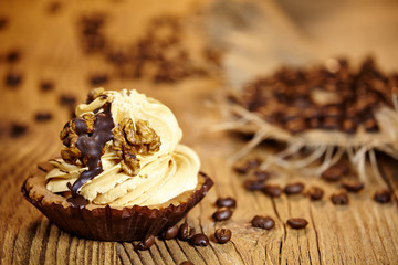 chocolate cupcake on old wooden table