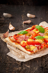 Pizza with ham, pepper and olives