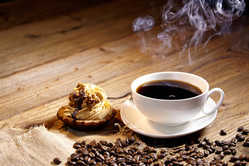 cake and coffee on old wood background