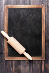 Menu slate chalk board with a rolling pin