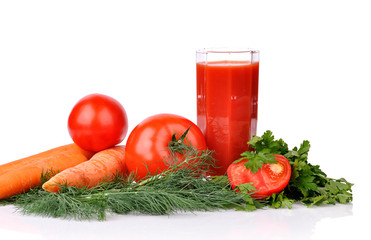 Full glass of fresh tomato juice and tomatoes with parsley, carr