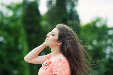 Portrait of beautiful girl with hair that flies in the wind