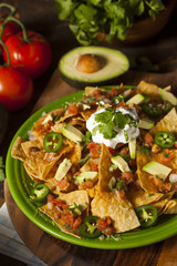 Homemade Unhealthy Nachos with Cheese and Vegetables