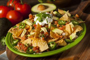 Homemade Unhealthy Nachos with Cheese and Vegetables