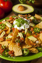 Homemade Unhealthy Nachos with Cheese and Vegetables