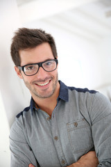 Cheerful handsome man with eyeglasses