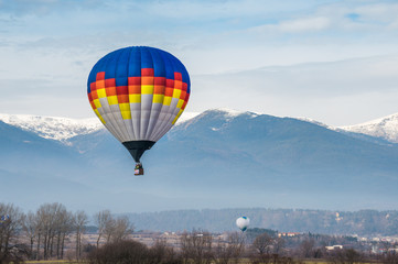 Obraz premium Multicolored Balloon in the blue sky