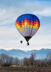 Fototapeta premium Multicolored Balloon in the blue sky