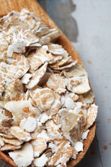 oat flakes in wooden spoon