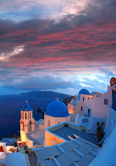Santorini with churches and sea view in Greece - obrazy, fototapety, plakaty