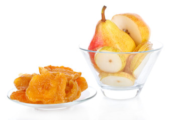 Dried pears in glass bowl, isolated on white