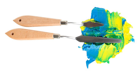 Painting palette knifes with paint isolated on white