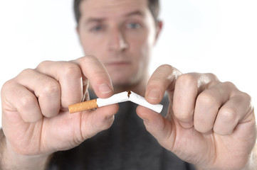 man breaking cigarette representing quit smoking