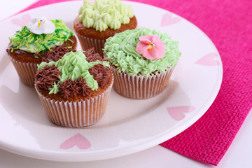Tasty cupcakes with butter cream,