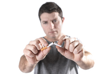 man breaking cigarette representing quit smoking