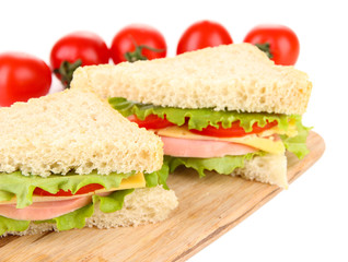 Fresh and tasty sandwiches on cutting board isolated on white