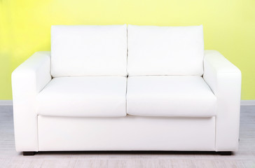 White sofa in room on green background