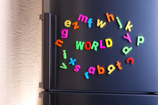 Word World spelled out using colorful magnetic letters