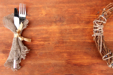 Spoon and fork on wooden table