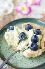 break Tart with Bilberry and Cheese cream on old table