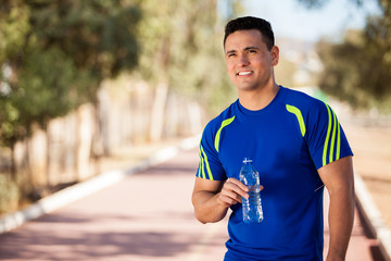 Naklejka premium Fit athlete taking a break