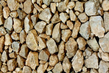 Sandy coloured stone wall