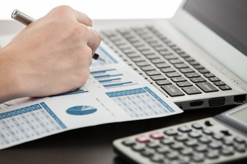 Businessman analyzing investment charts