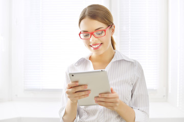 Young business woman with tablet pc