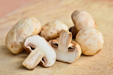 Champignon on wooden background