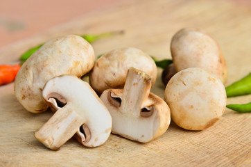 Champignon on wooden background