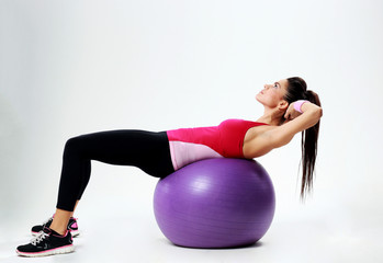 Fototapeta premium woman doing abs workout on fitball
