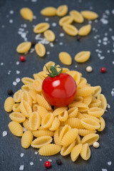 Italian pasta shells, cherry tomatoes, salt and pepper
