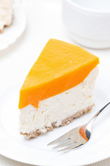 piece of cheesecake with pumpkin jelly, top view