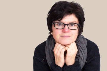 Portrait of a woman with glasses in middle age