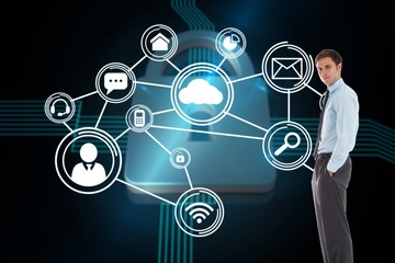 Composite image of serious businessman standing with hands in po
