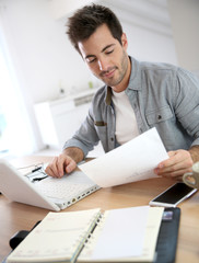 Man working from home with laptop