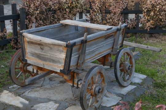 Small wooden empty old cart
