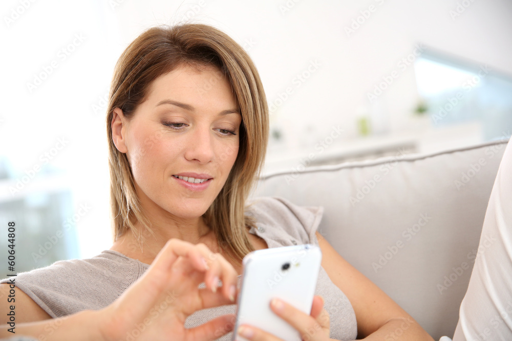 Sticker Middle-aged woman sending message with smartphone