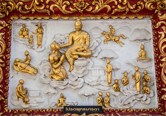 Ancient golden carving wooden window of Thai temple. Thailand