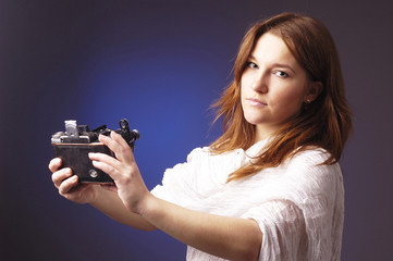 young girl  with retro camera