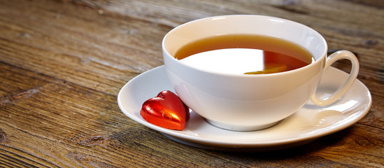 Cup of tea with lemon on the wooden table