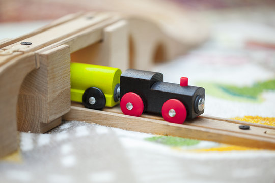 little toy wooden train rides on Rails