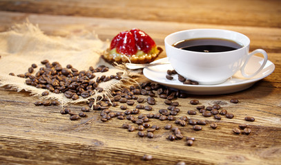 cake and coffee on old wood background