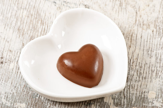 chocolate heart on a plate in the shape of heart